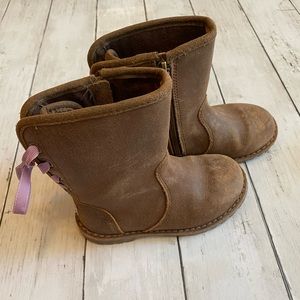 Uggs boots with lace up backs.
